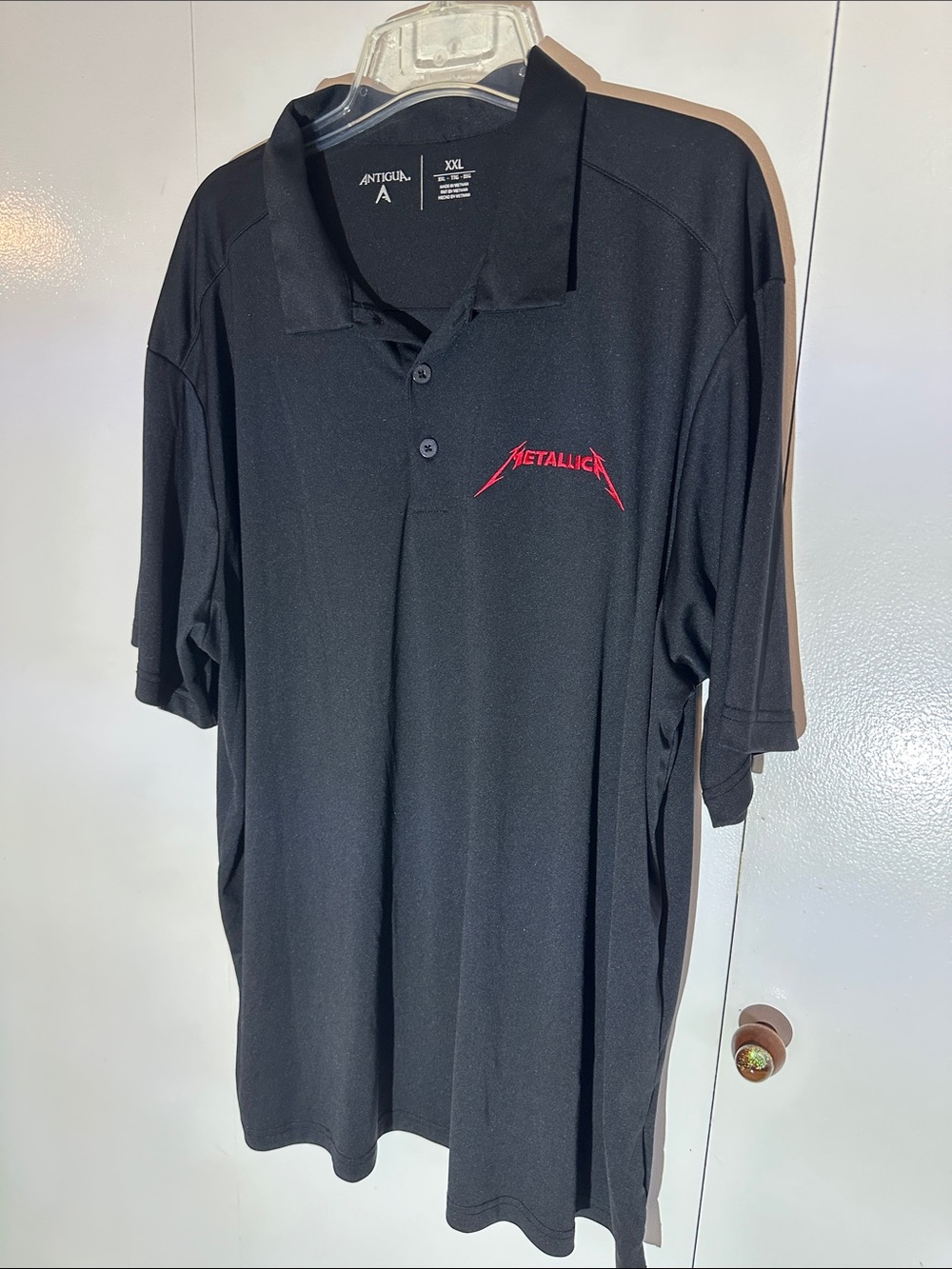Antigua Black Polo with Red Metallica Logo